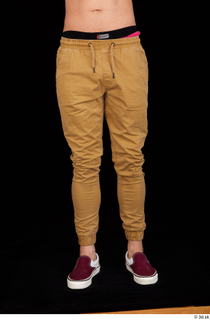 Pablo brown trousers dressed leg lower body red sneakers 0001.jpg